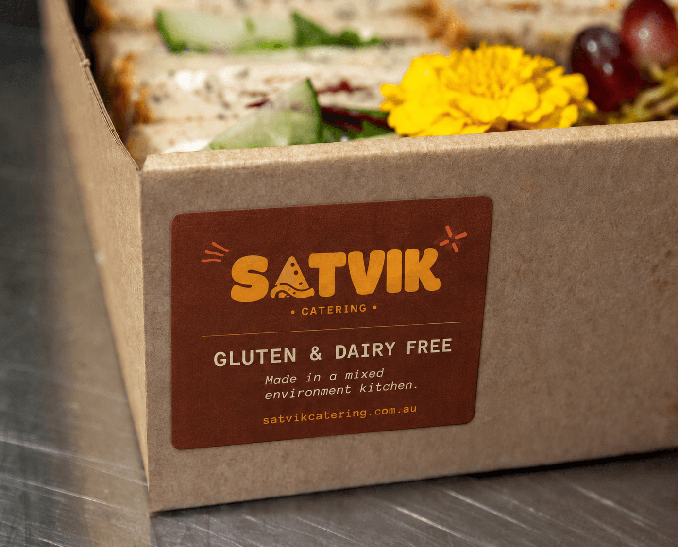 Clearly labelled dietary and allergen cards next to a grazing box spread