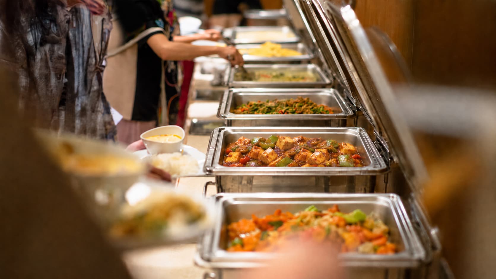 Delivered and ready-to-serve catering trays set up at a venue