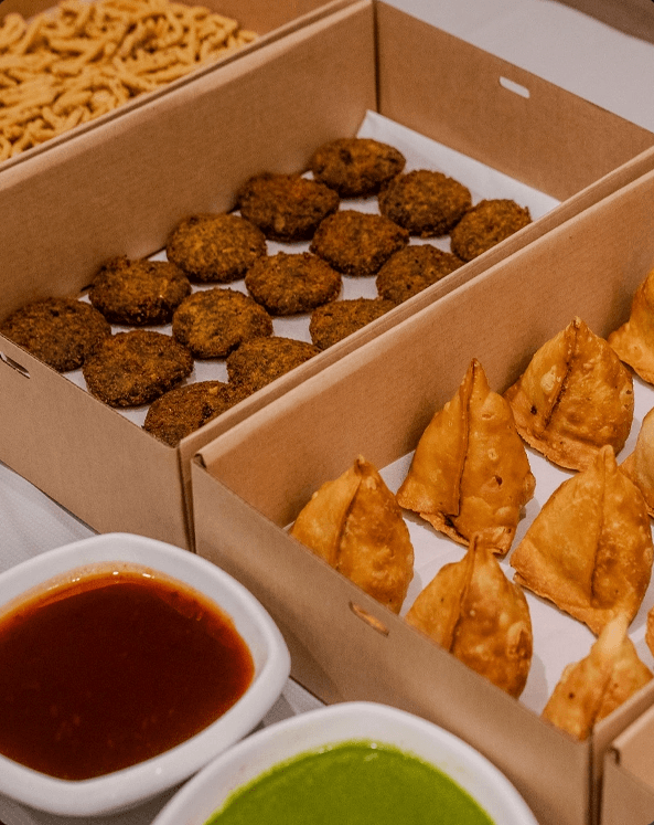 Individually packed vegetarian meal boxes ready for workplace delivery